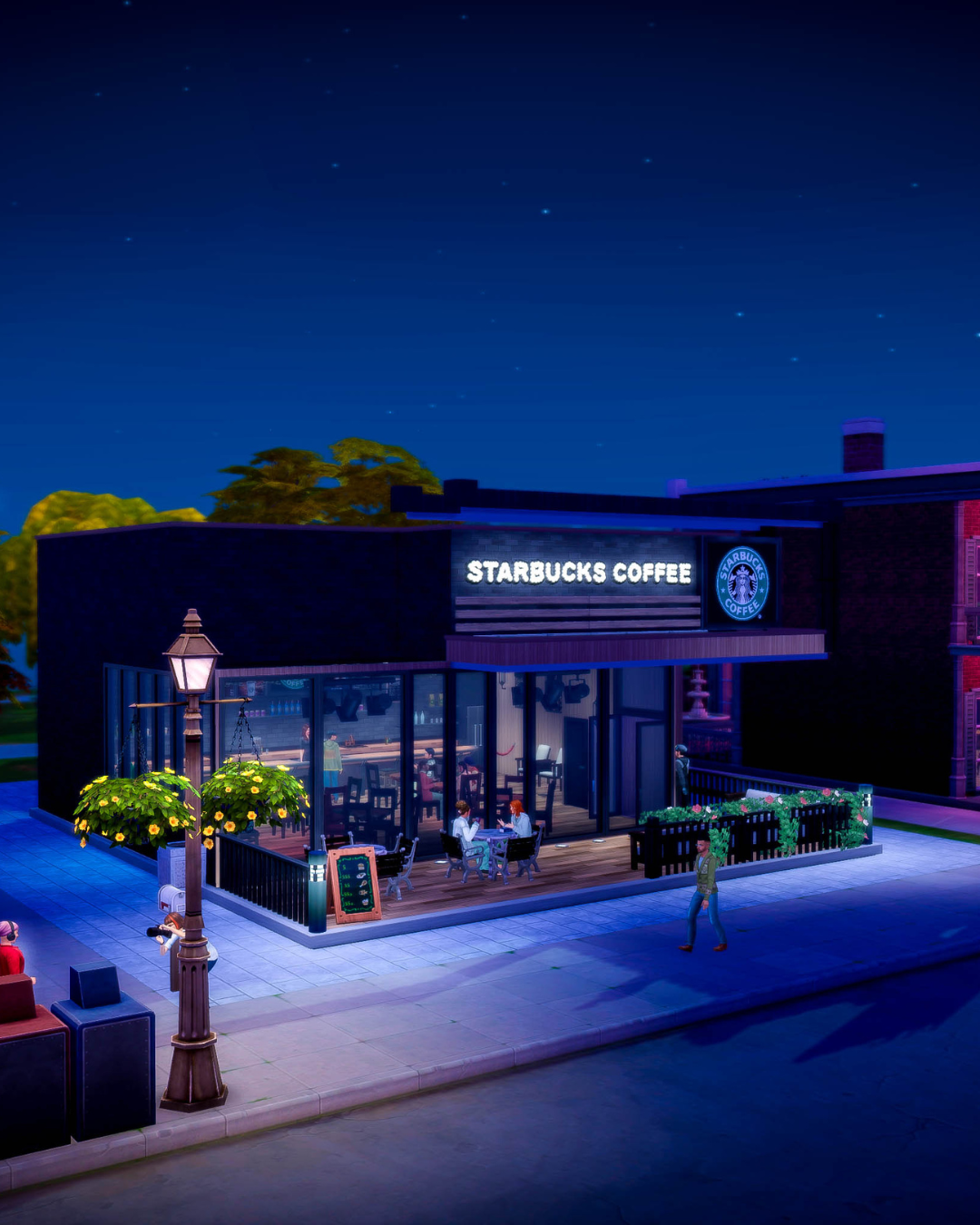 A dreamy night shot of Jaime and Kristine sitting at a table outside of Starbucks.